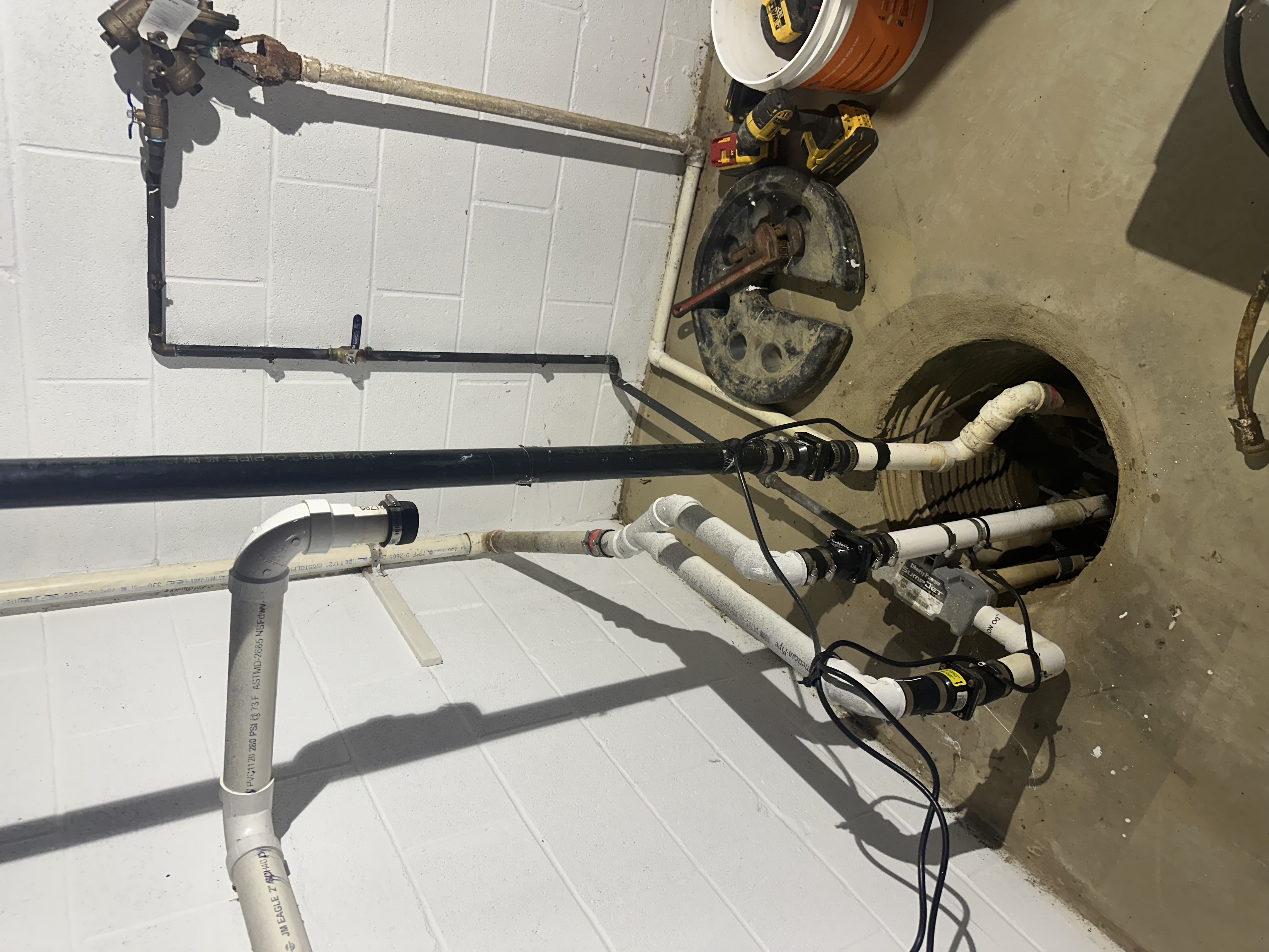 Old sump pump pit before replacement installation - Northeast Ohio basement plumber