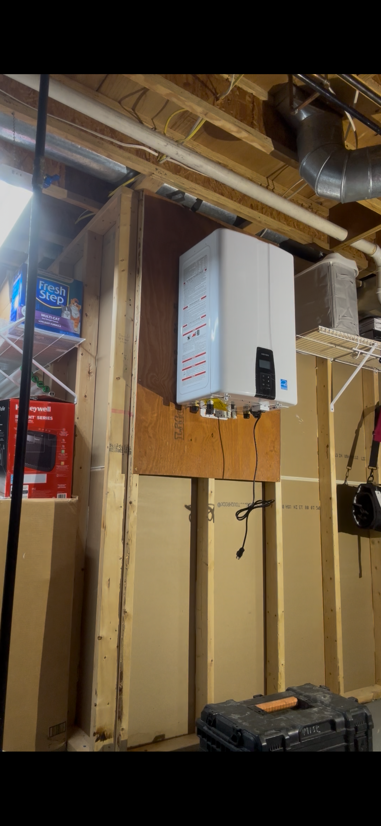 New tankless water heater wall-mounted installation by Gray's Precision Plumbing - Ohio